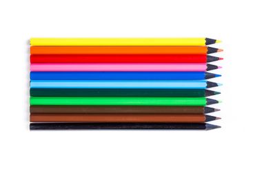 Collection of colorful pencils arranged in a row on a...