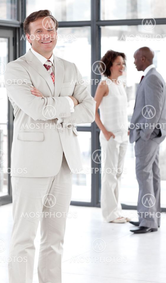 portrait of a caucasian male manager leading his team