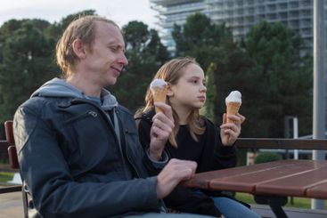 Happy Father and Daughter Enjoying Ice Cream Together...