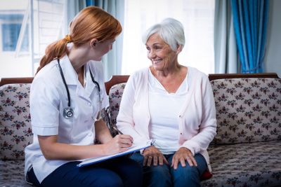 Doctor consulting with senior woman 