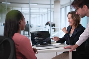 Busy Programmer Juggling Code in High-Tech Meeting Room