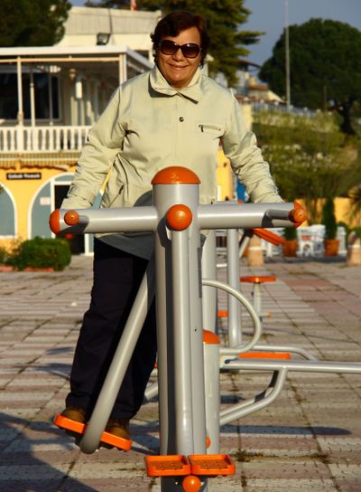 old woman doing sport in park