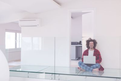 young freelancer in bathrobe working from home