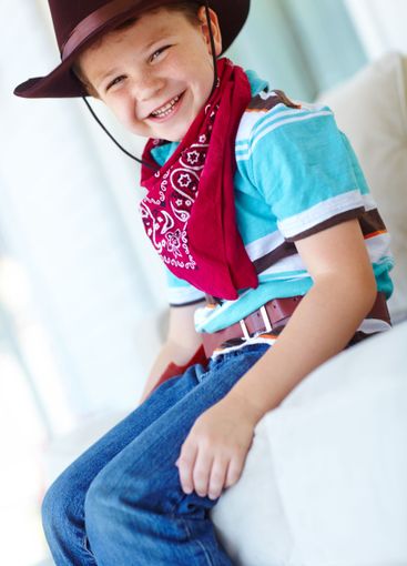 Portrait, cowboy or child with smile in home, childhood...