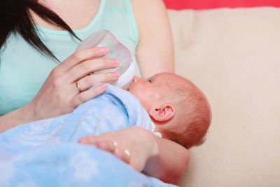 Mother holding her little newborn baby