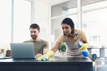 Couple, laptop or working with housekeeping for clean...