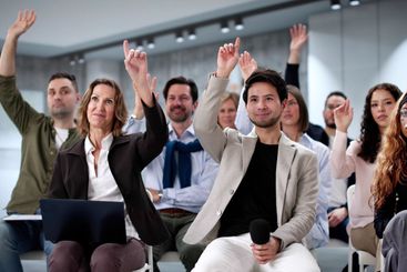 Diverse group of business professionals attending...