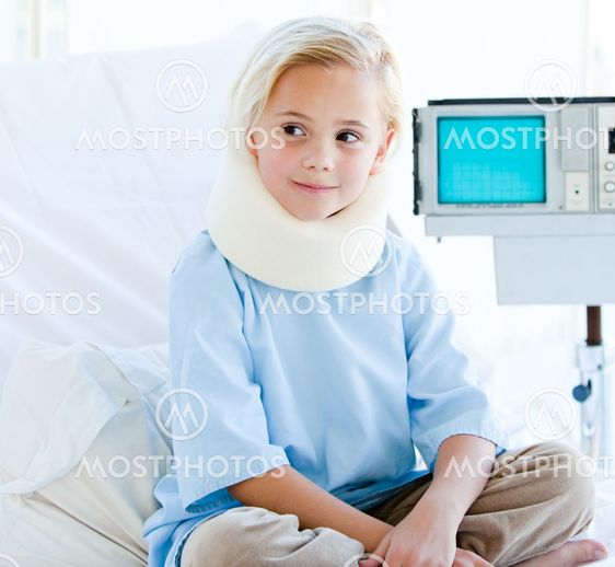 Little girl with a neck brace sitting on a hospital bed