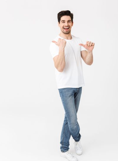 Full length portrait of a cheerful young man