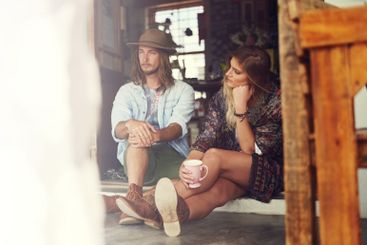 Couple, travel and together at coffee shop on street,...