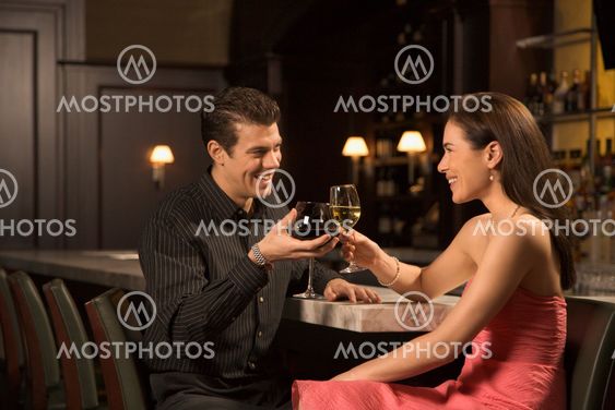 Couple at bar.