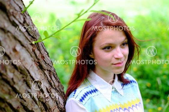 The girl near a tree