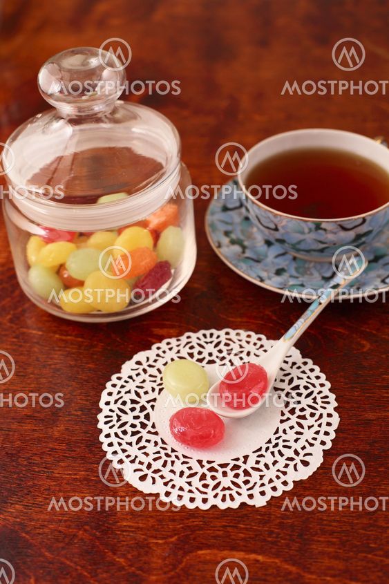 Tea with coloured sugar candies