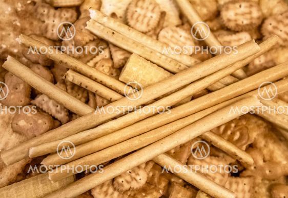 Cookies, crackers, sticks and waffles background