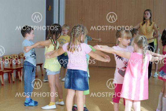 Children dance in kindergarten