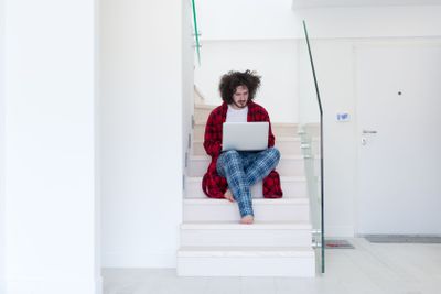 freelancer in bathrobe working from home
