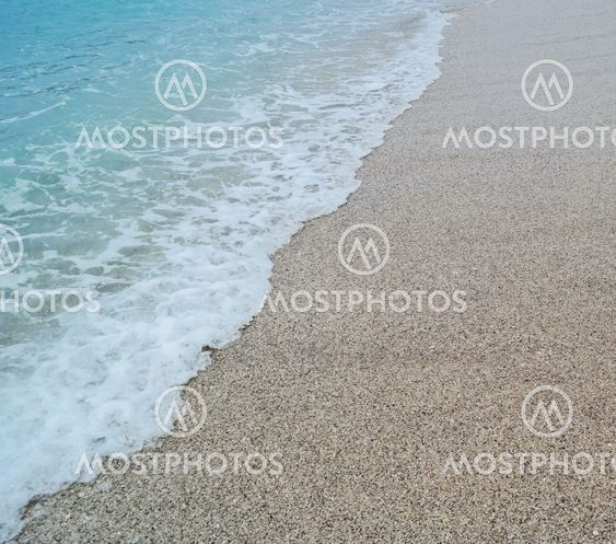 sand beach and blue wave sea
