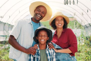 Farmer, happy and portrait with family in greenhouse for...