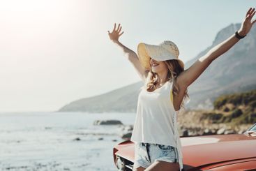 Travel, car and woman with celebration, seaside and...