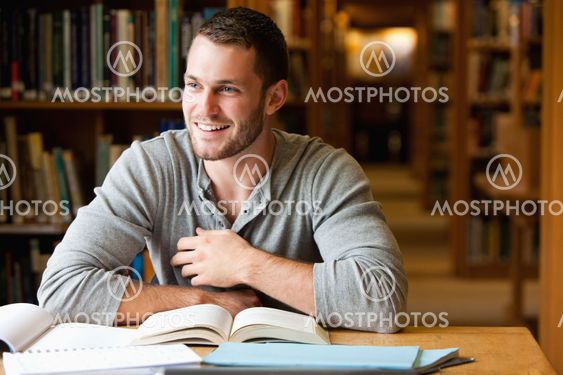 Smiling male student working