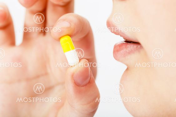 woman takes pill
