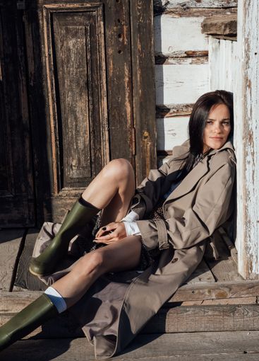 Beautiful fashionable brunette woman in gray coat on...