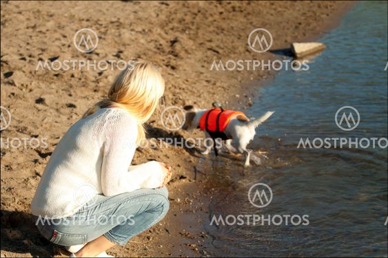 Woman and dog on the water