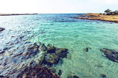 Daylight view to Nissi Beach with colorful bright blue...