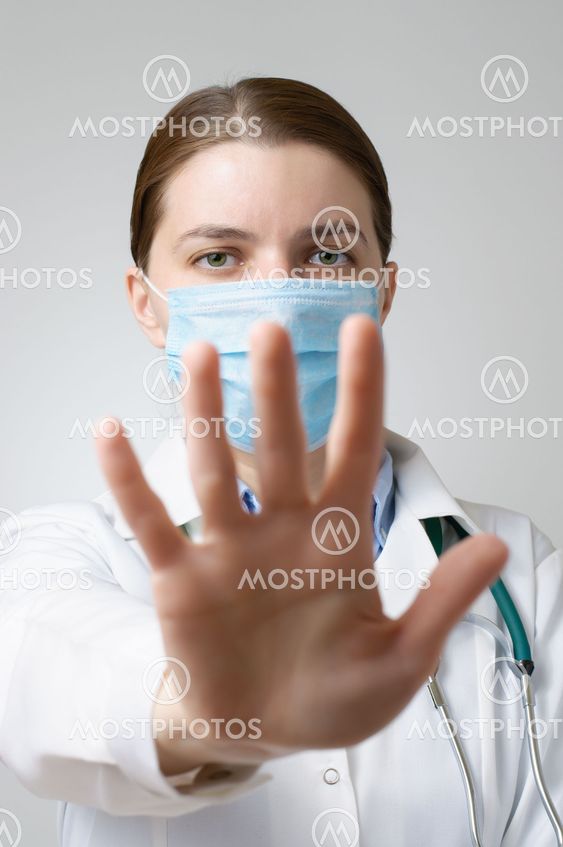 Doctor showing stop sign