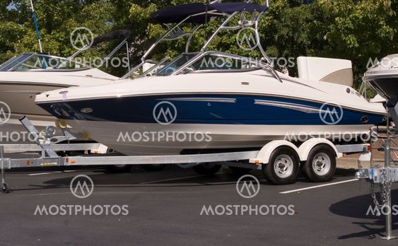 Blue and White Boat on Trailer