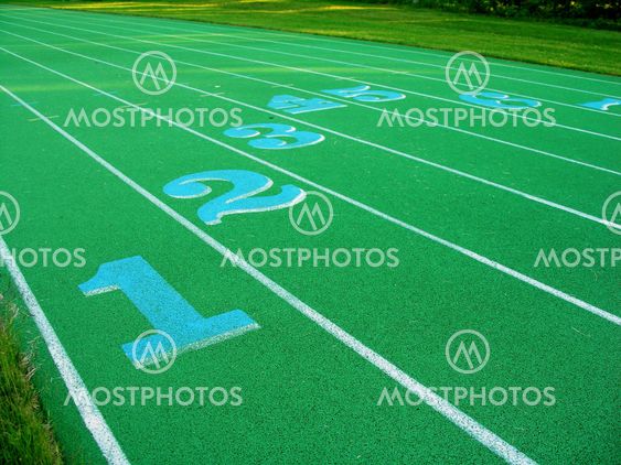 Closeup on green running track.