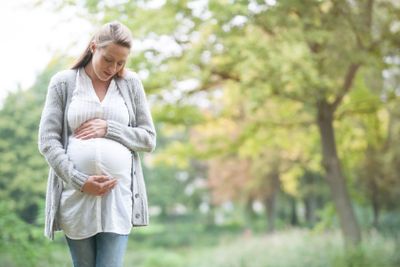 Expecting woman in nature