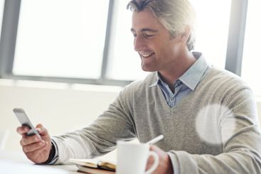 Phone, notebook and smile with business man in office...