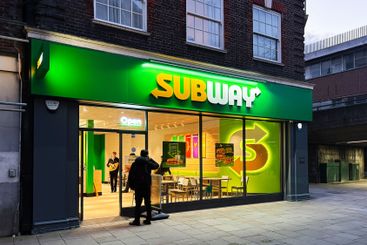 Modern Subway Restaurant Front Entrance at Evening with...