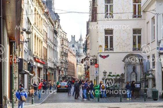 Brussels, Belgium - April 2015: Group of tourists visiting Manneken Pis or Little Man Pee, a landmark small bronze sculpture designed by Hiëronymus Duquesnoy the Elder, located near Grand Place in the city of Brussels, Belgium