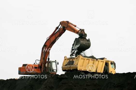 Excavator loading truck