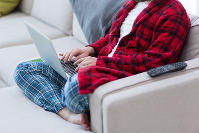 man freelancer in bathrobe working from home