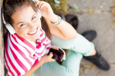 girl with headphones listening to music