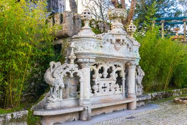 Old romantic bench at park of Quinta da Regaleira palace...