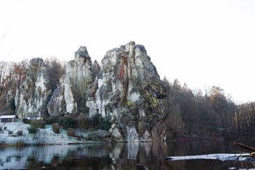 Large rocky rocks on a background of water. Rocks of...