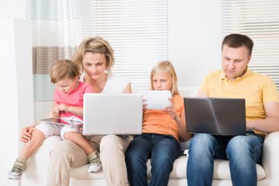 Family Using Tablets and Computers