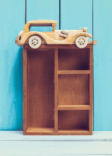 Cozy pastel wooden home decor objects on blue background