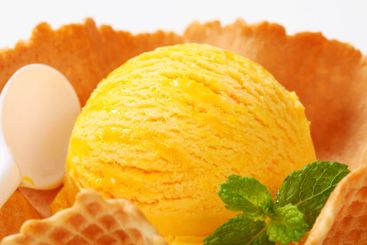 Yellow ice cream in wafer bowl