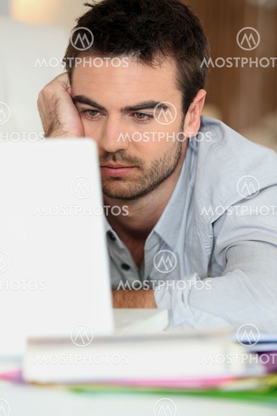Tired man in front of computer