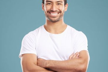 Portrait, happy and confident man with arms crossed with...