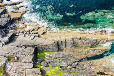 Aerial view of rough rocky shore along famous Ring of...