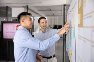 Successful multiethnic businessmen making business model...