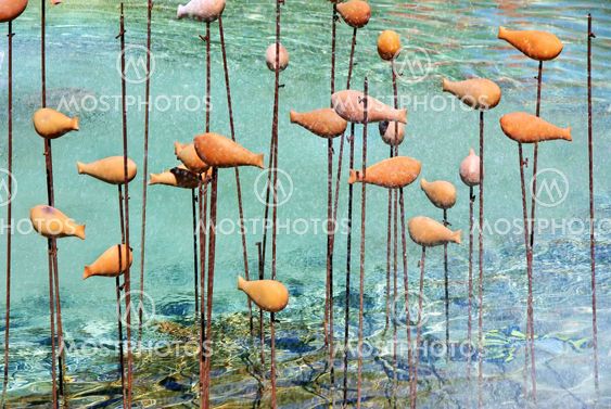 background of sculpture fishes, on lake