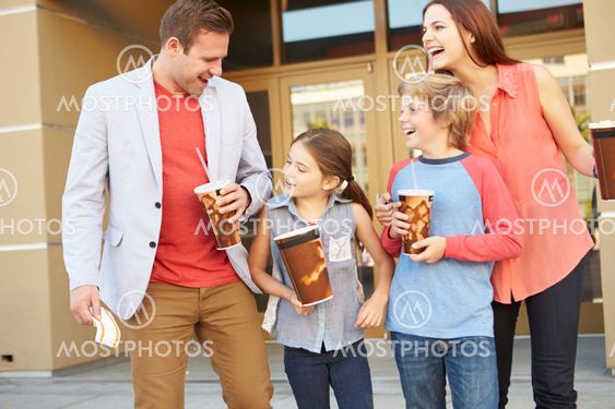 Family Standing Outside Cinema Together