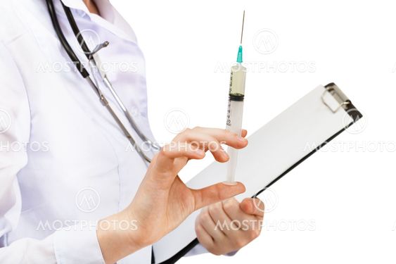 doctor holds syringe and clipboard isolated